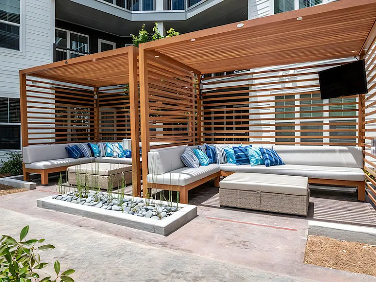 Outdoor Lounge with Covered Cabanas and Built-In Seating
