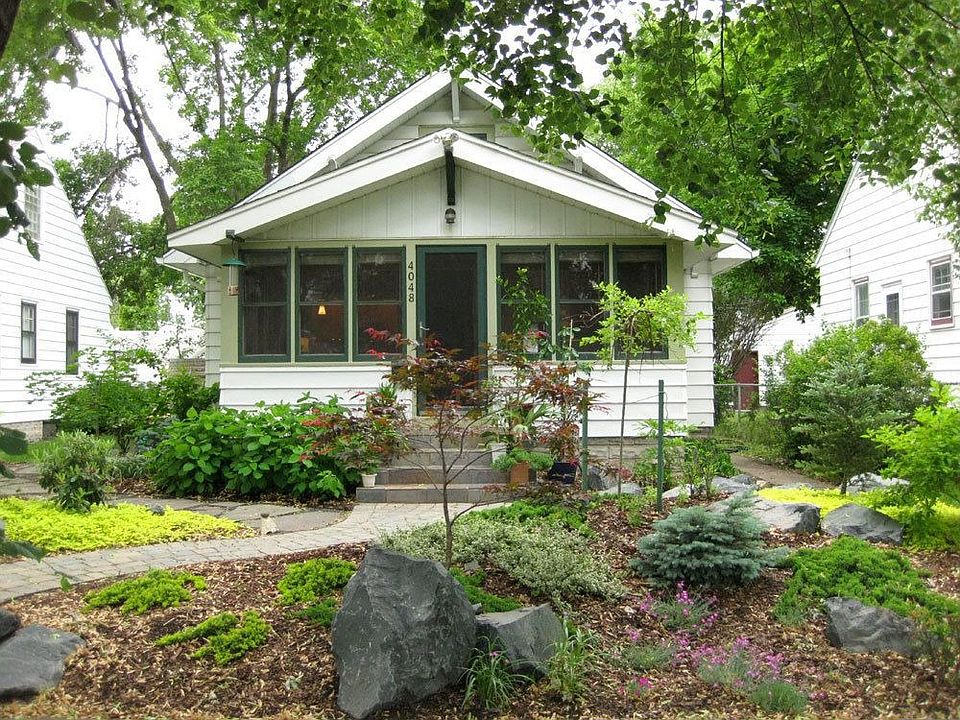 Front with professional landscaping, new roof
