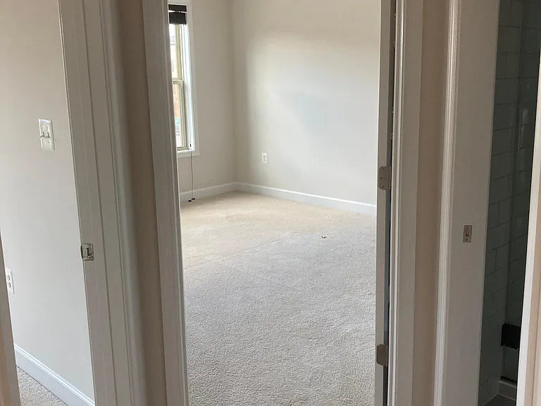 Hallway leading into Bedrooms 2/3 & Shared Bathroom