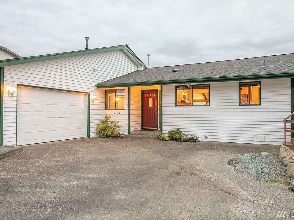 Welcome home say's it all. Our Skyline home supports ample off street parking, easy care landscaping, organic gardening, green house, storage building, outside deck dining, marina and Island views.
