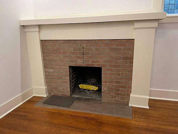 Brick fireplace in main bedroom