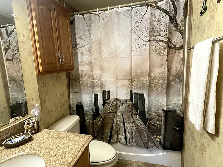Private bathroom with large vanity mirror