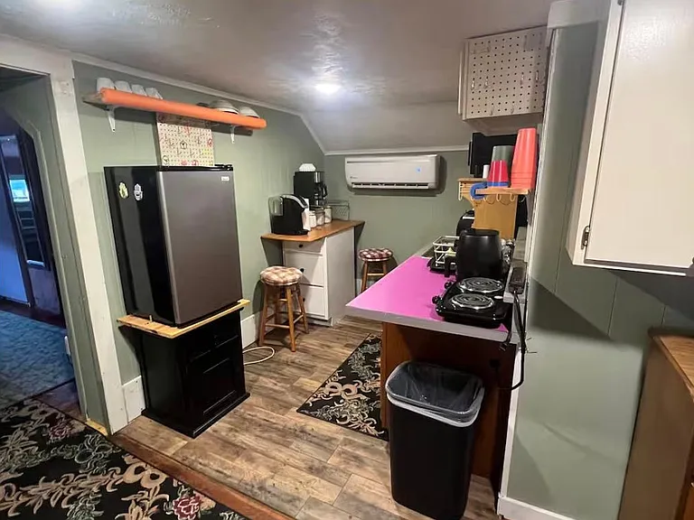 2nd floor kitchen with microwave, electric cook top, hot air fryer, desktop oven, blender, cups dishes utensils, coffee makers, compact fridge. Most everything you'll need