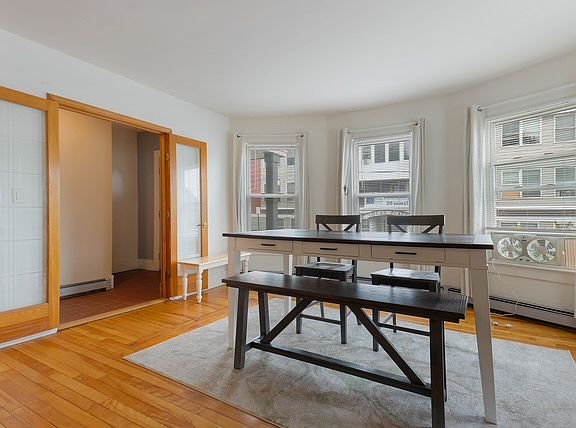 Large table that can be used for activities, work or formal dining- there is another breakfast table in the kitchen.