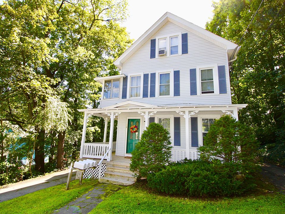 Second floor unit has many windows for light and bright interior.