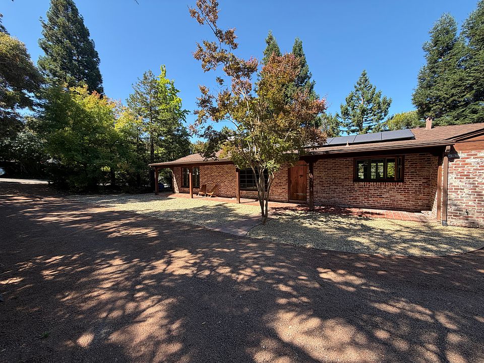 Front of house with pull through driveway
