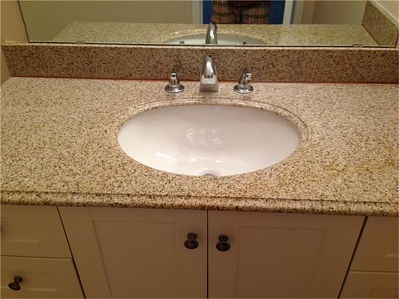 Each bedroom has a full bath. This one even with granite tops