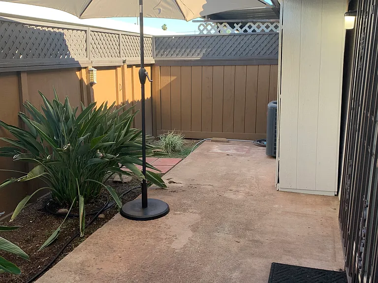 Gate access to two covered parking spots.
