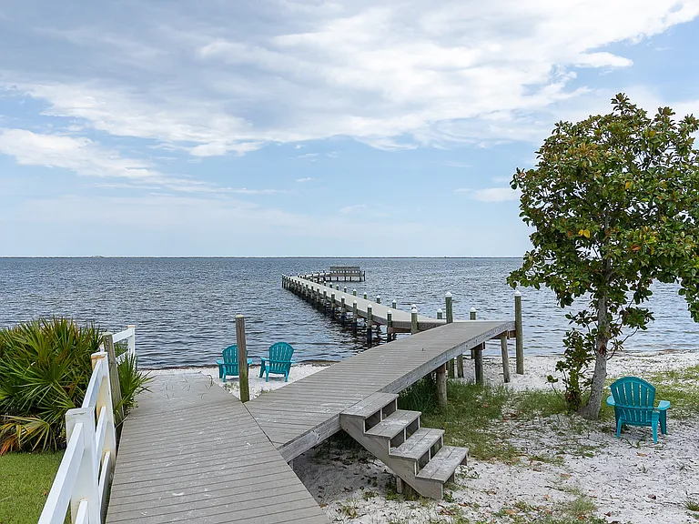 The neighborhood pier is a short 900ft walk from the house.