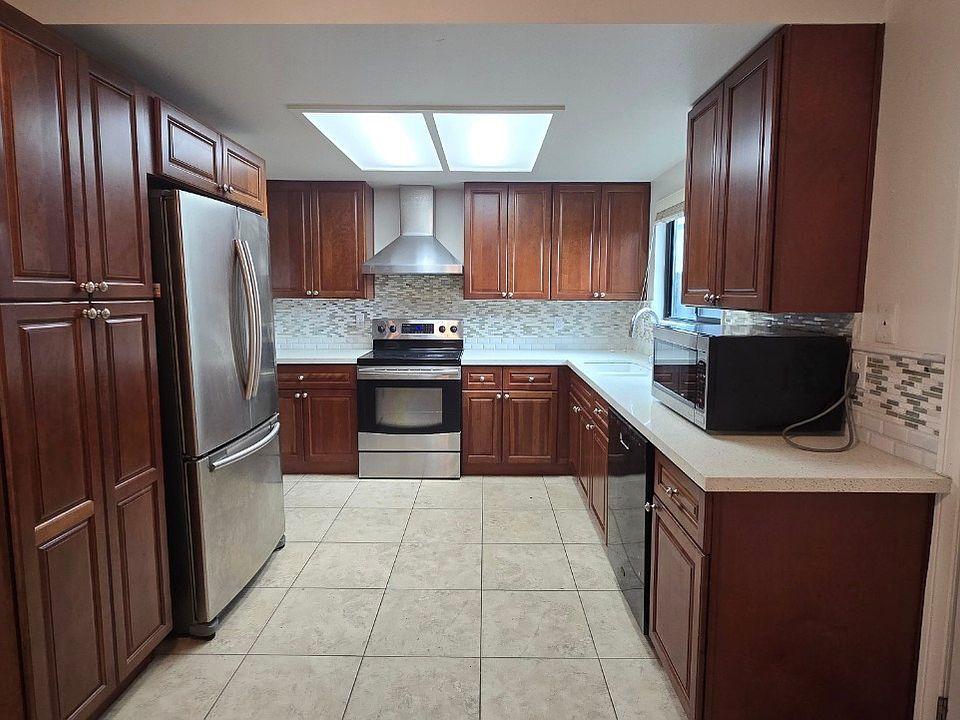 Kitchen 
This beautiful kitchen features stunning hardwood cabinets, offering ample storage space and a warm, inviting feel. The layout is both practical and stylish.