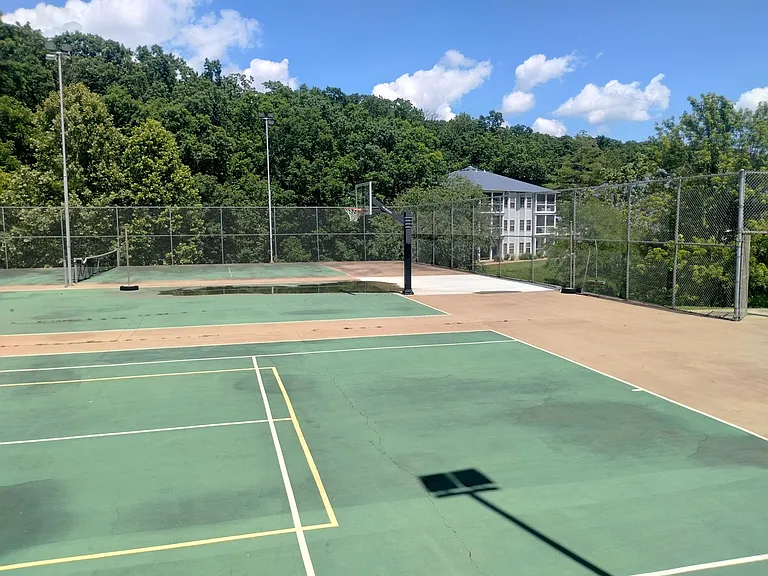 Tennis courts and basketball hoop