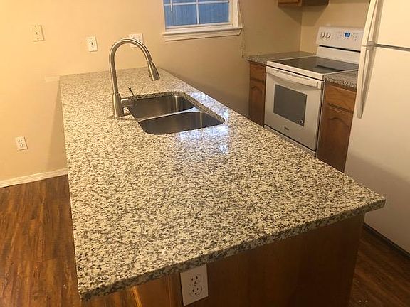 New granite counter top and faucet, new refrig and range/oven