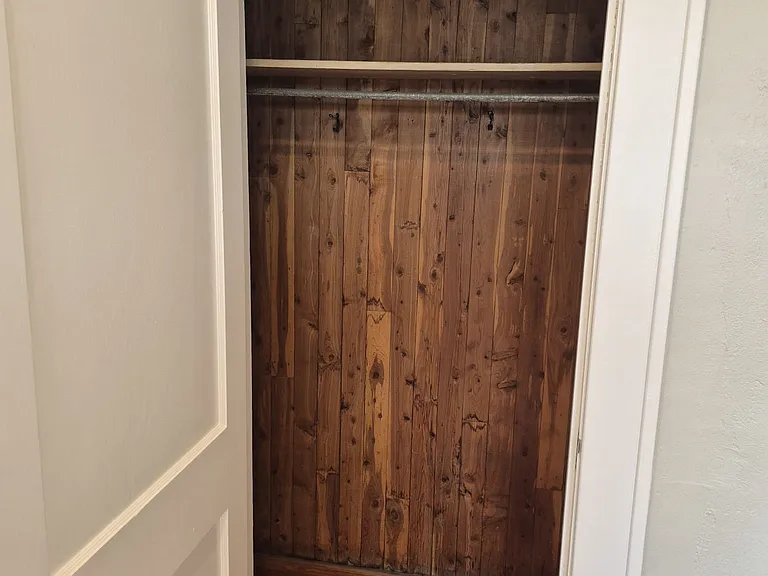 Bedroom includes closet with air mattress for occasional extra guests staying in the en suite room.