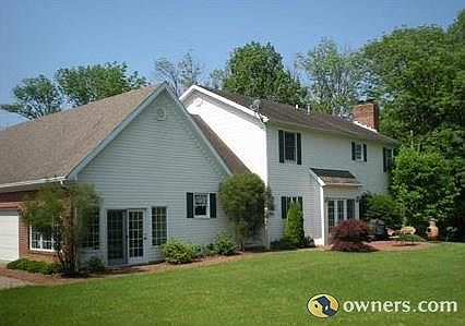 View of back of house, patio.