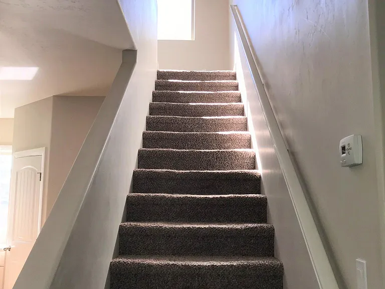 Stairs Leading the 3 Bedrooms, 2 Baths and Media Niche