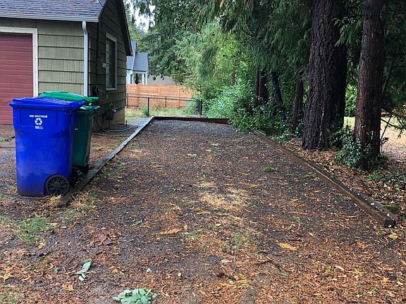 in addition to the long driveway, there is a parking spot along the side that would fit an RV or a boat