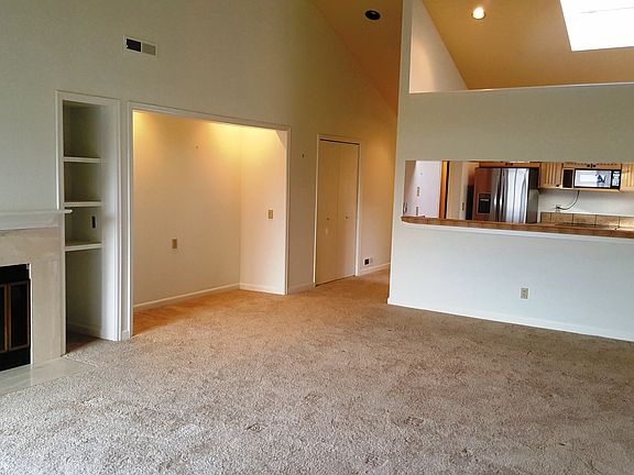Living & Dining rooms have super high vaulted ceilings, view