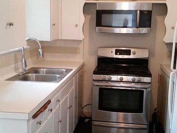 Stainless Steel oven. There is a dishwasher and breakfast no