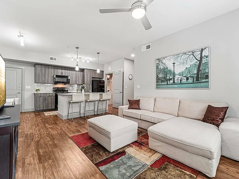 Enjoy contemporary style and comfort in The Broadway's elegant living room.