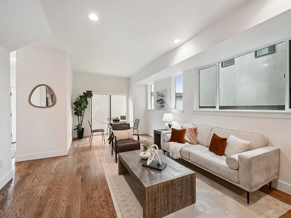 Open plan dining, living and kitchen with fireplace on the ground floor. Sliding glass doors leading to private, fenced back yard with space for dog run.