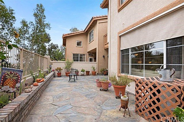 Inviting large private courtyard with slate and brick accents