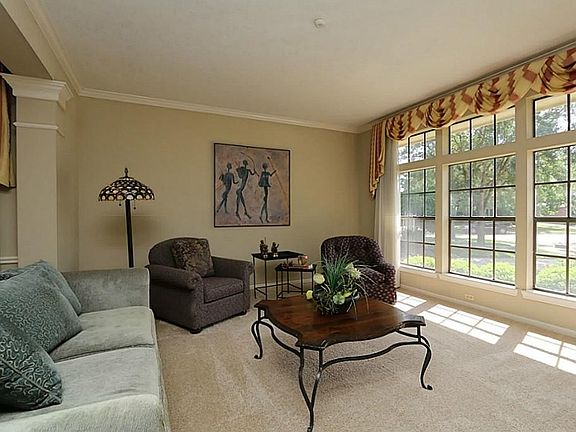 Just off the entry is the gorgeous formal living space. Large over-sized floor to ceiling windows, w