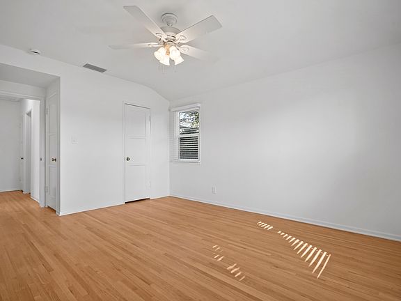 Master bedroom with 2 walk-in closets