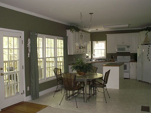 Kitchen with breakfast area, island, & pantry opens to deck for grilling 