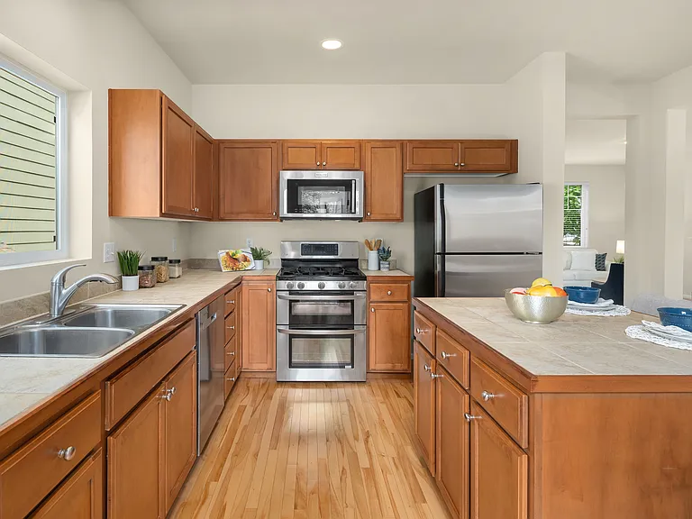 Kitchen with center island and stainless steel appliances