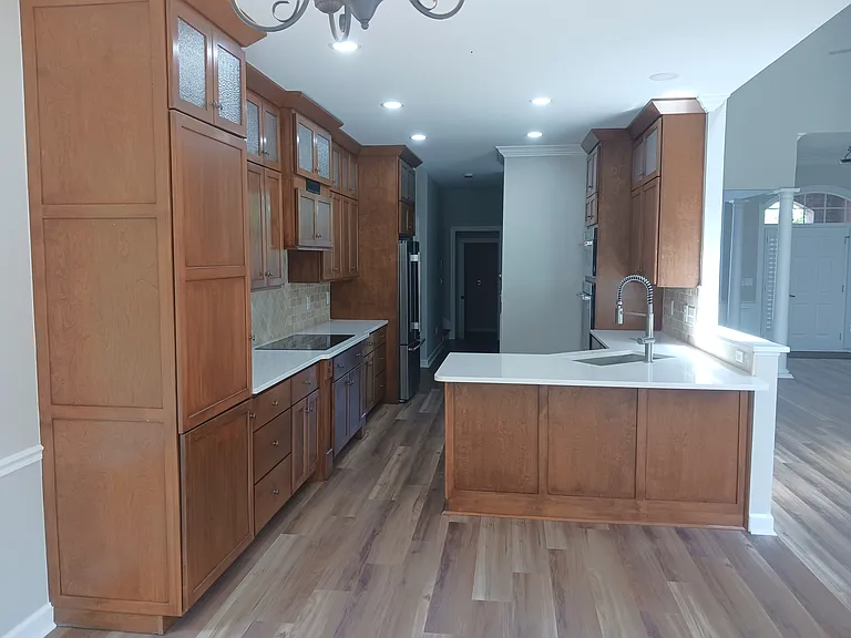 Kitchen has tons of storage with pull-out shelves and soft-close doors.