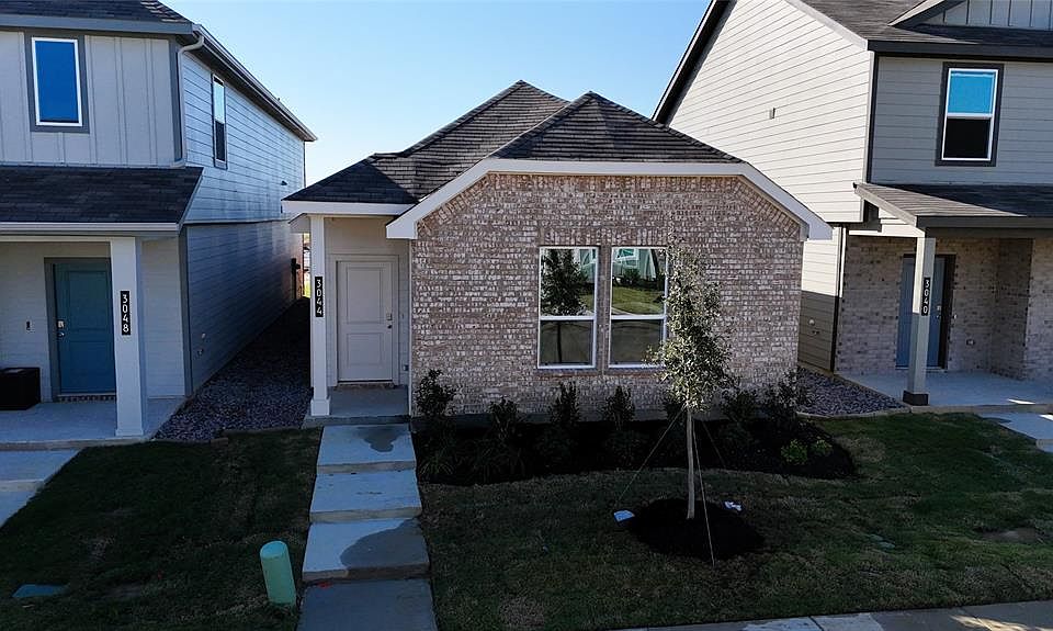 Front Elevation - D.R. Horton''''s AcornFloorplan Elevation B - All Home and community information, including pricing, included features, terms, availability and amenities, are subject to change at any time without notice or obligation. All Drawings, pictures, photographs, video, square footages, floor plans, elevations, features, colors and sizes are approximate for illustration purposes only and will vary from the homes as built.