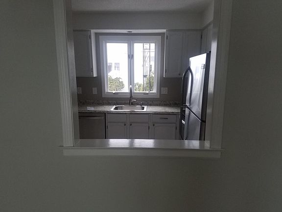 Kitchen opening to dining