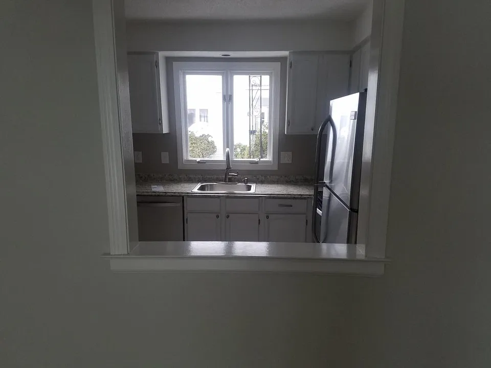 Kitchen opening to dining