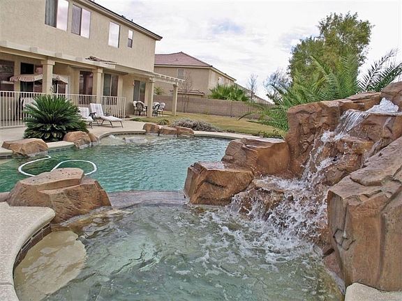Waterfall, Pool & Spa in park like Back Yard!