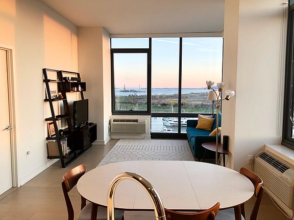 Living/Dining with view of Statue of Liberty