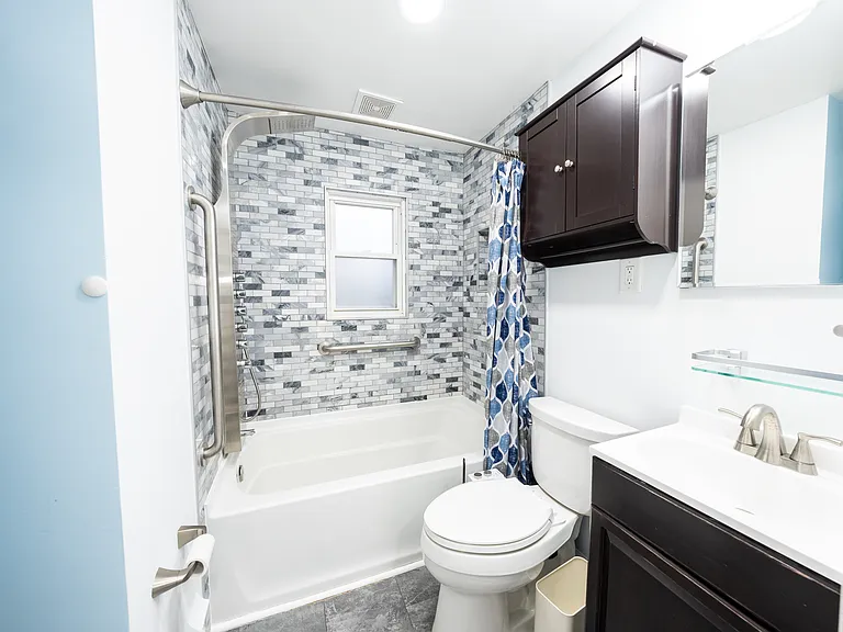 One of three full bathrooms.