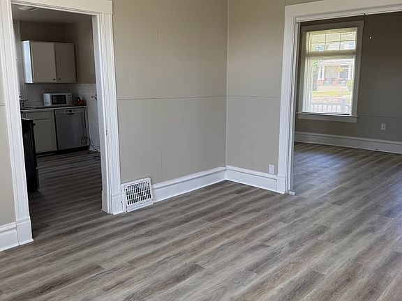 view from main floor bed to kitchen and living room
