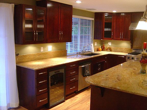 Sink side of kitchen with wine refrigerator, undercabinet lighting, dishwasher