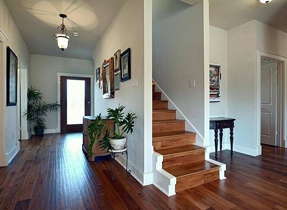 The entry and other areas of the home have rich looking teak wood floors which welcomes you with a warm feeling. Also, the home has double pane windows, while the door/window casings and base boards are real or solid wood (no pressed boards). Panel doors 