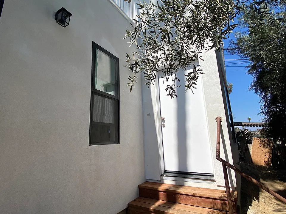 Private entrance and yard to your own nestled haven with lots of natural light. Upstairs is the rooftop deck which covers the entire rooftop!