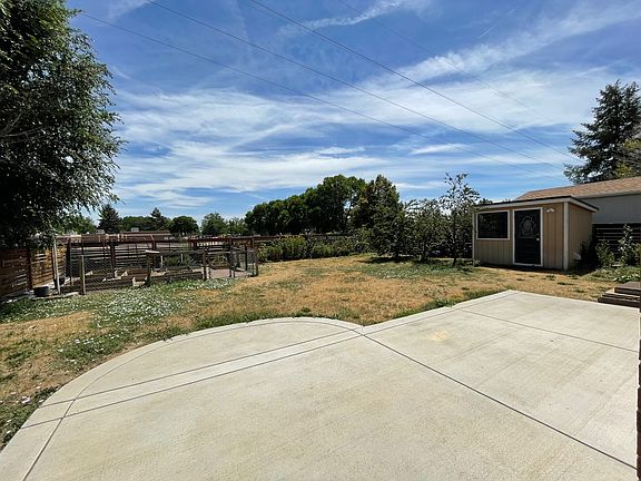 Backyard patio with view of shed. Alley access, too.