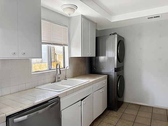 Kitchen with new washer/dryer and dishwasher