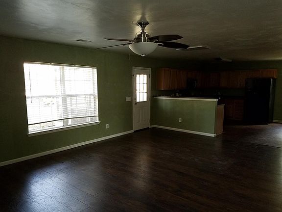 Living room opens up to kitchen