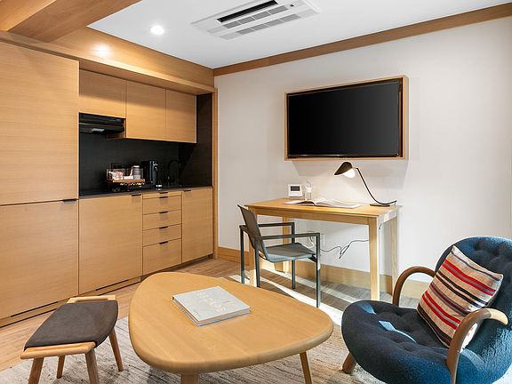 Kitchenette equipped with a Ninja blender, Nespresso Verturo coffee station with pods, mini-fridge and freezer.