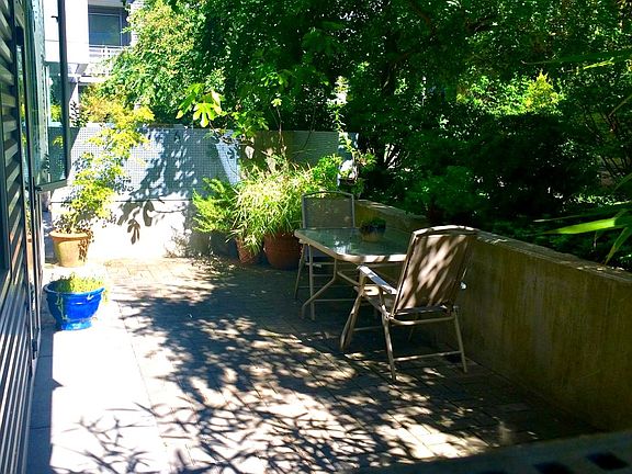Rare 200 sq ft private patio surrounded by greenery _ perfect for outdoor dining or working from home