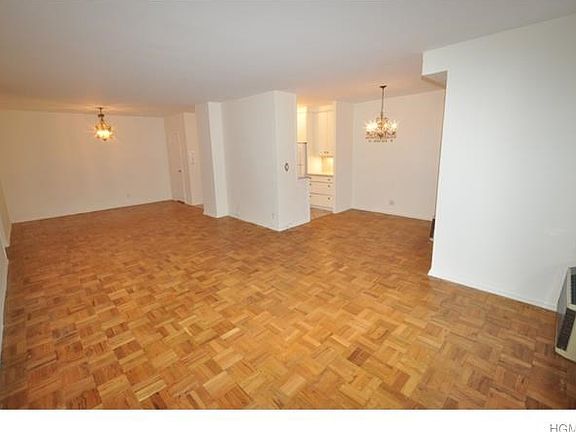 Oversized living room and "L" shape dining room overlooks the quiet courtyard and has parquet Floors.  The room is 30'-2" x 12'-4"