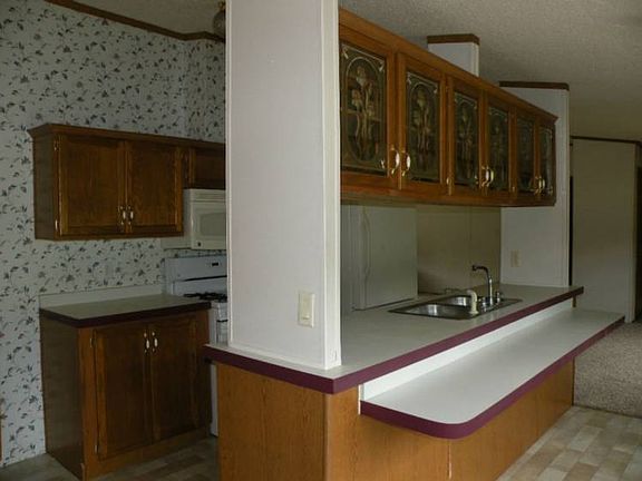More kitchen cabinets.