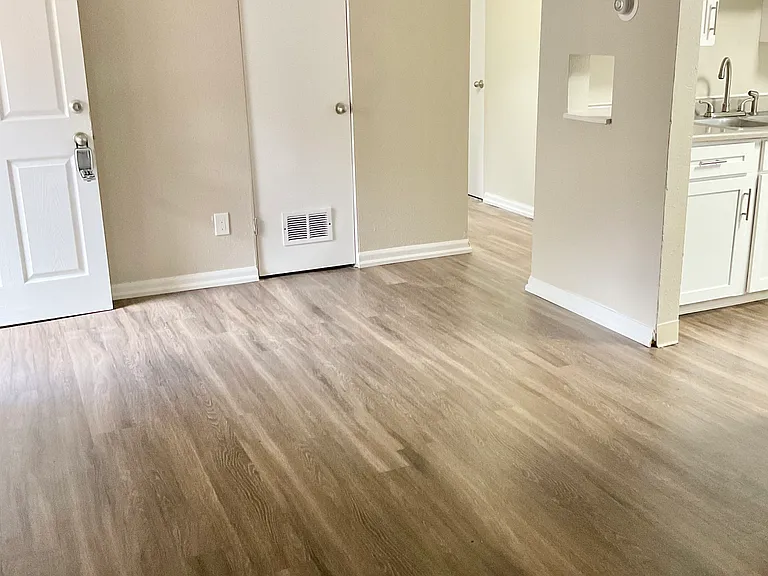 Experience the charm of modern living with this open space featuring sleek hardwood floors. Experience the charm of modern living with this open space featuring sleek hardwood floors.
