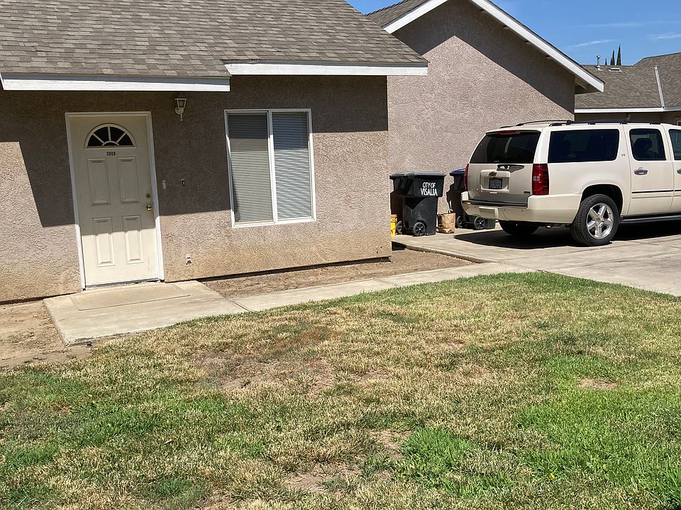 Front of apartment with outside parking