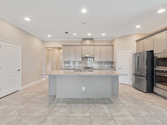 Kitchen with large corner pantry